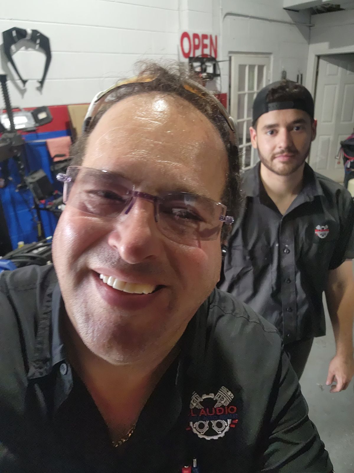 Claudio and a technician, shop open